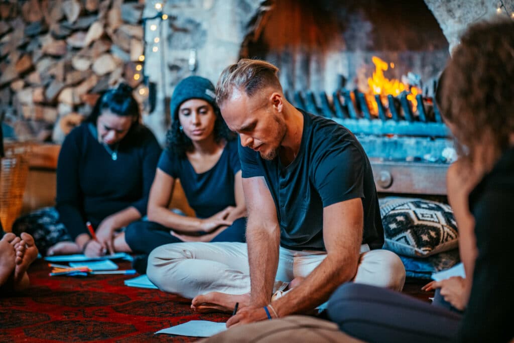 Johannes shows how to perform breathing techniques during the breathwork instructor course