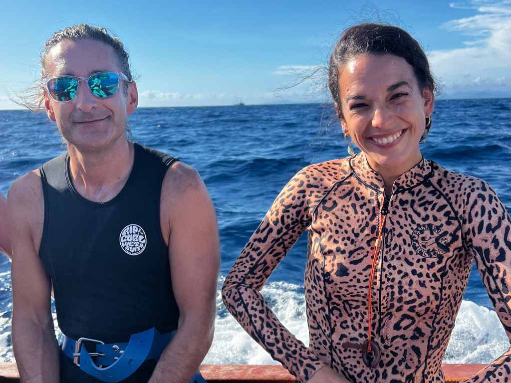 TWO PEOPLE ON A SPEED BOAT IN KRI ISLAND